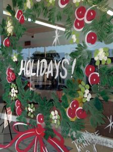 Hand-painted wreaths by artist Donna Miniere greet customers at Jon's Cleaners in Orlando, Dec. 20, 2013.